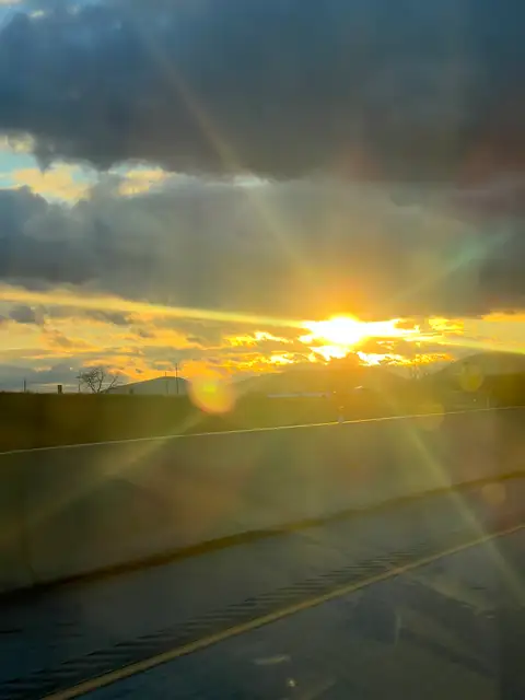 Chasing the sun's last rays on the highway.